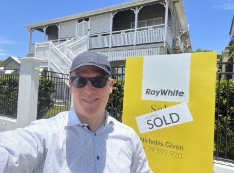 Buyer's Agent Sam Price standing outside a property recently purchased. 